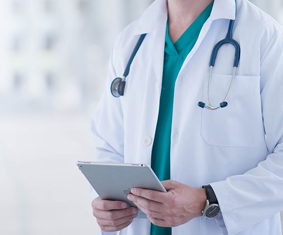 Healthcare Provider Holding A Tablet