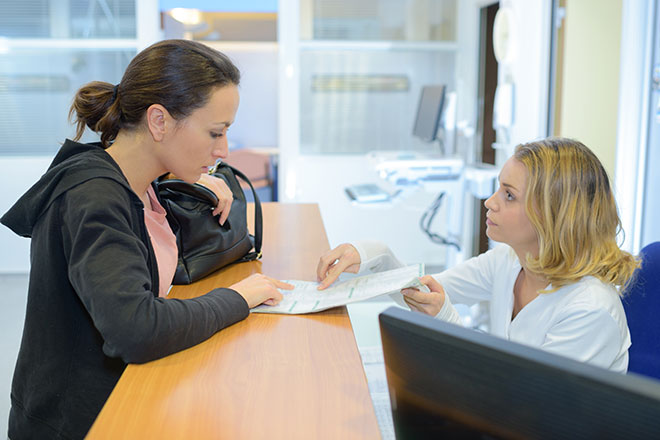 Patient Reviewing Document with Medical Professional